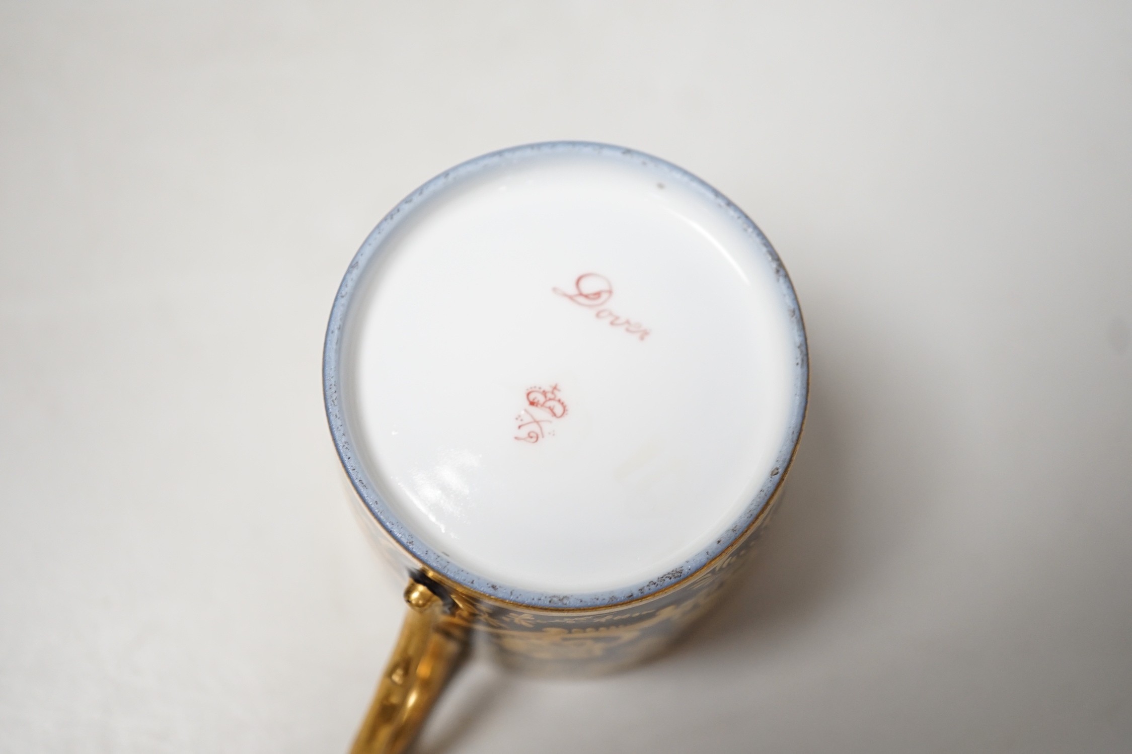 A Continental Derby style cup and saucer, 8cm tall overall